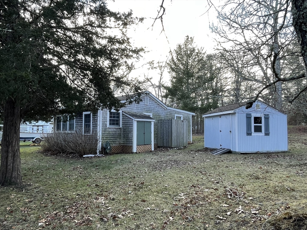 1634 Drift Road, Unit T Westport, MA 02790 - Photo 4 of 18 a house that has a backyard