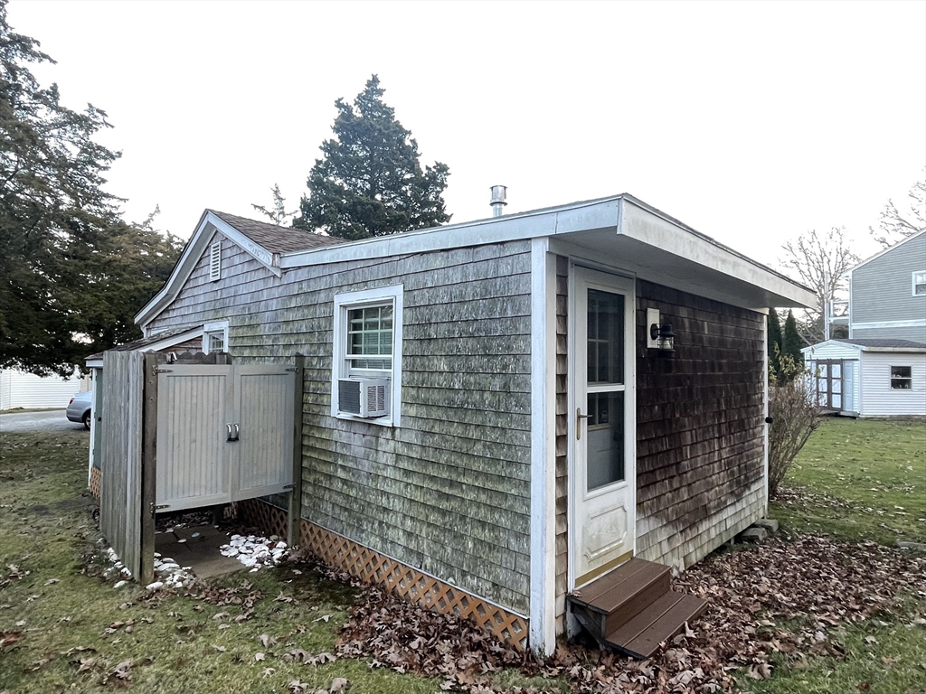1634 Drift Road, Unit T Westport, MA 02790 - Photo 5 of 18 a view of a small house with yard