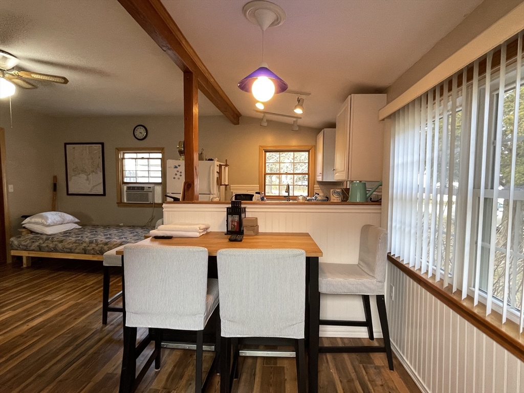 1634 Drift Road, Unit T Westport, MA 02790 - Photo 6 of 18 a view of a dining room with furniture and wooden floor