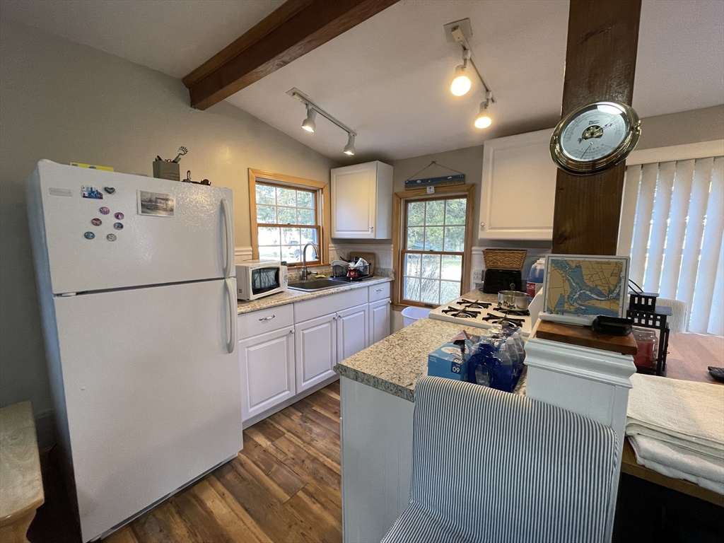 1634 Drift Road, Unit T Westport, MA 02790 - Photo 8 of 18 a kitchen with a refrigerator and a stove