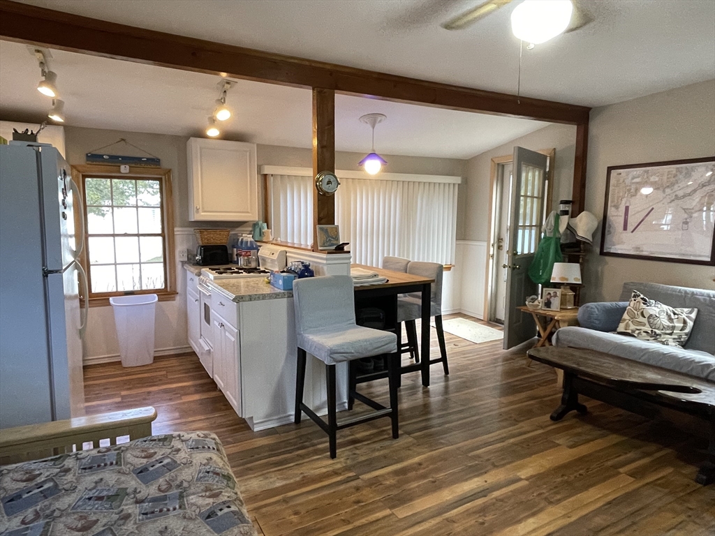1634 Drift Road, Unit T Westport, MA 02790 - Photo 9 of 18 a living room with furniture and a wooden floor