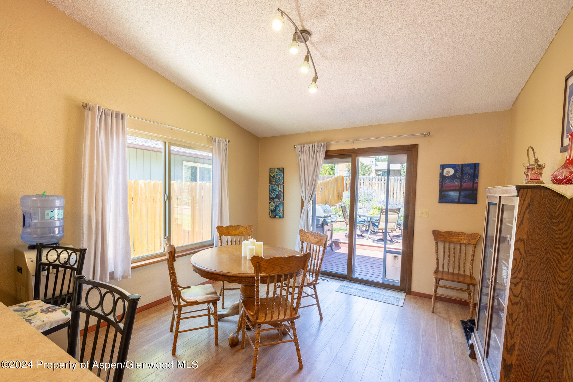 720 East 5th Street Rifle, CO 81650 - Photo 8 of 27 a view of a dining room with furniture window and wooden floor