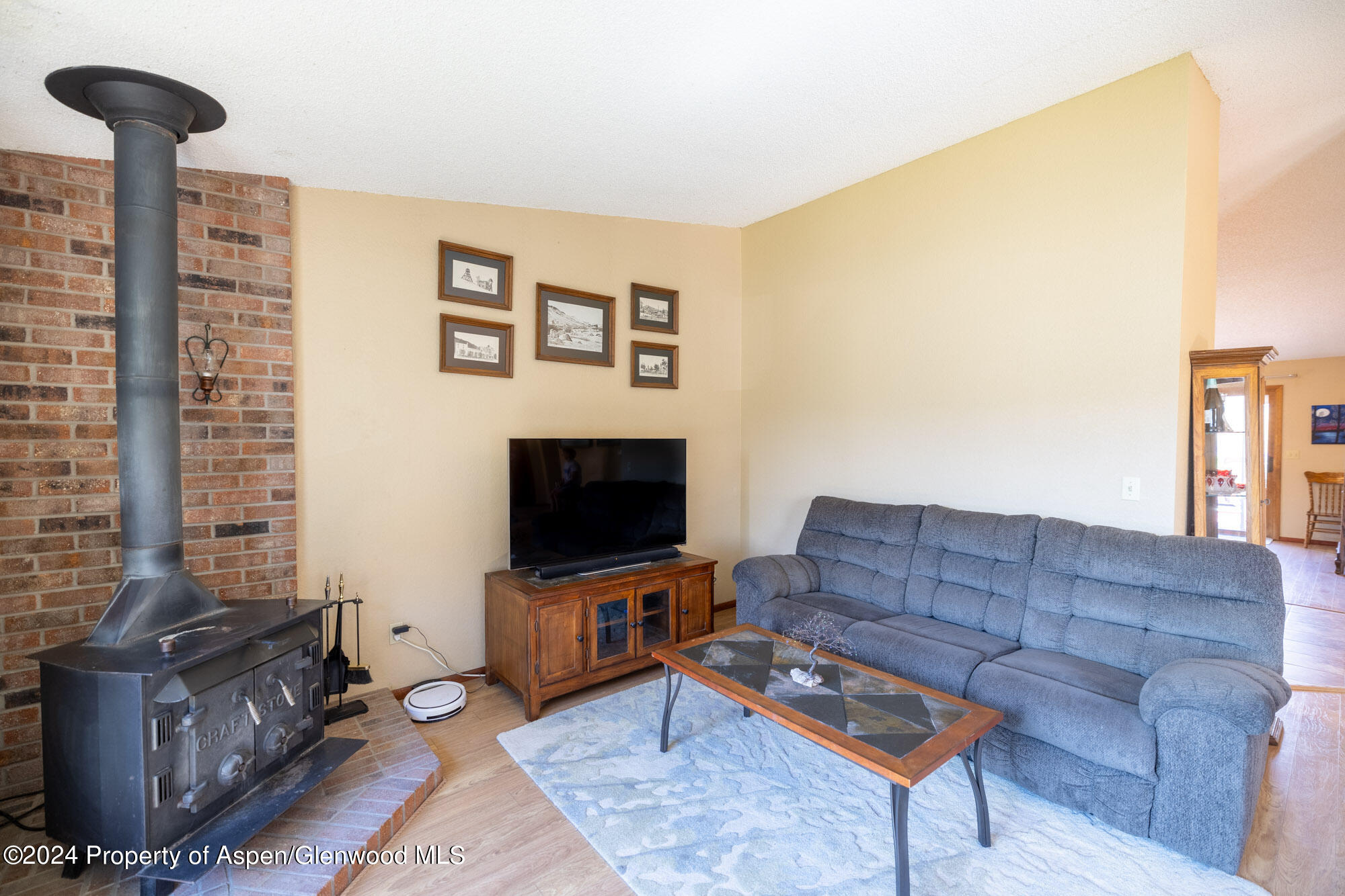 720 East 5th Street Rifle, CO 81650 - Photo 10 of 27 a living room with furniture and a flat screen tv