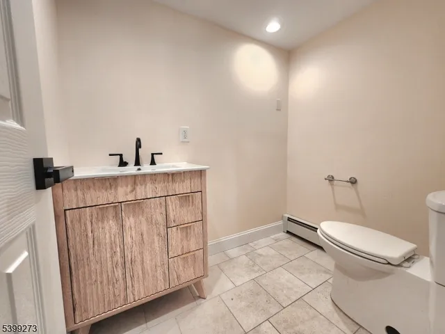 a kitchen with a stove a sink and a refrigerator