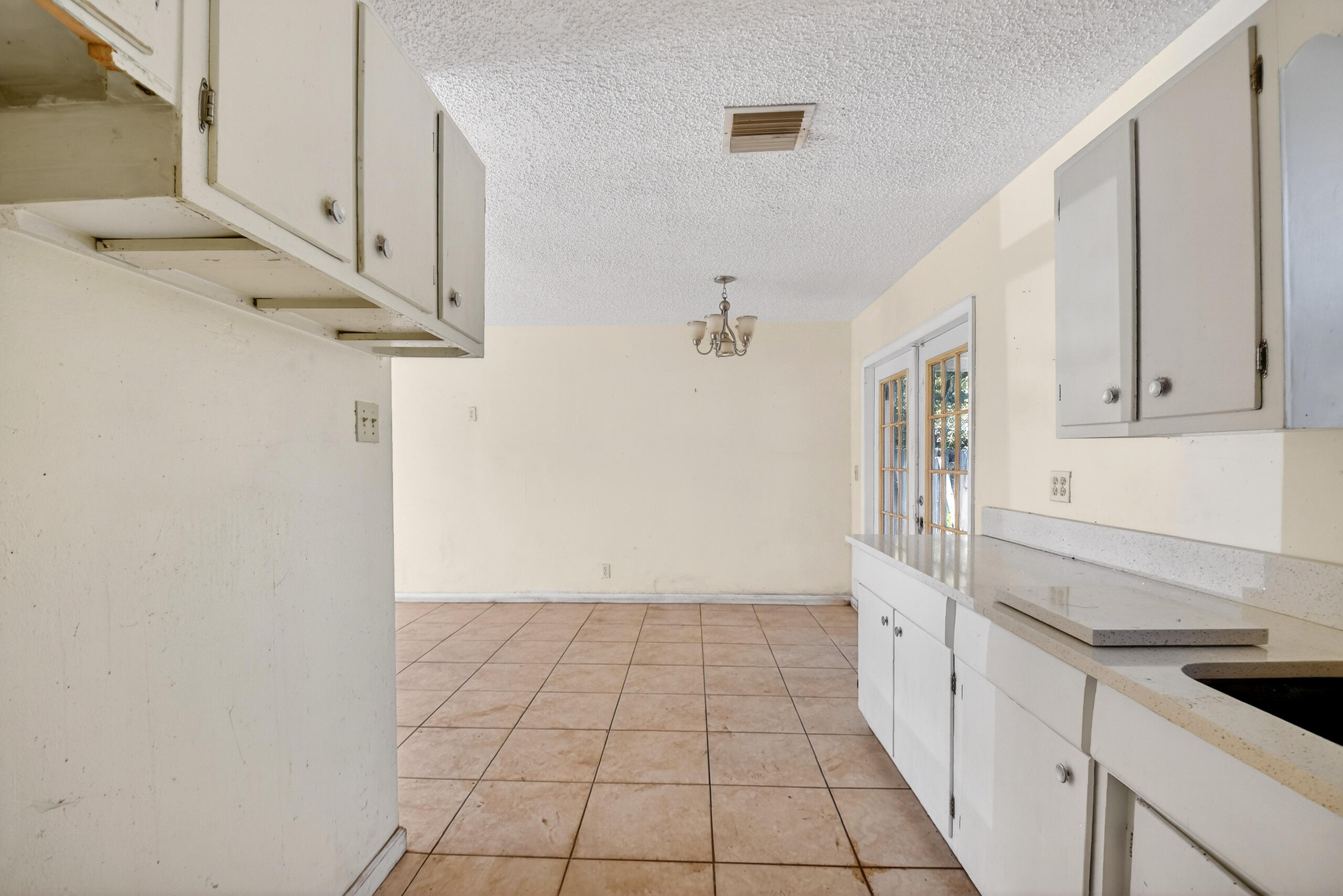 2013 Longwood Road West Palm Beach, FL 33409 - Photo 11 of 41 a view of a kitchen with white cabinets