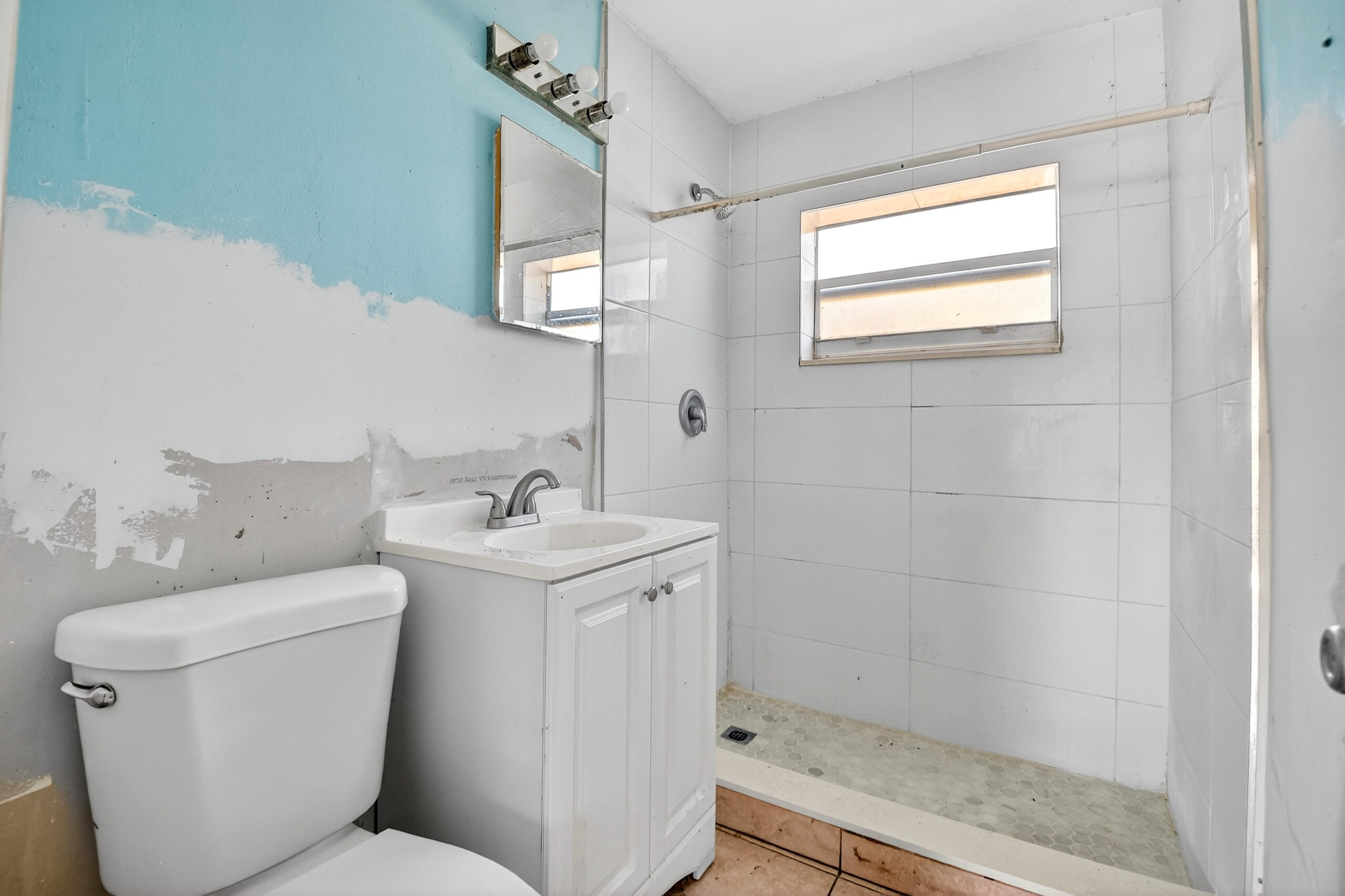 2013 Longwood Road West Palm Beach, FL 33409 - Photo 15 of 41 a bathroom with a sink toilet and shower