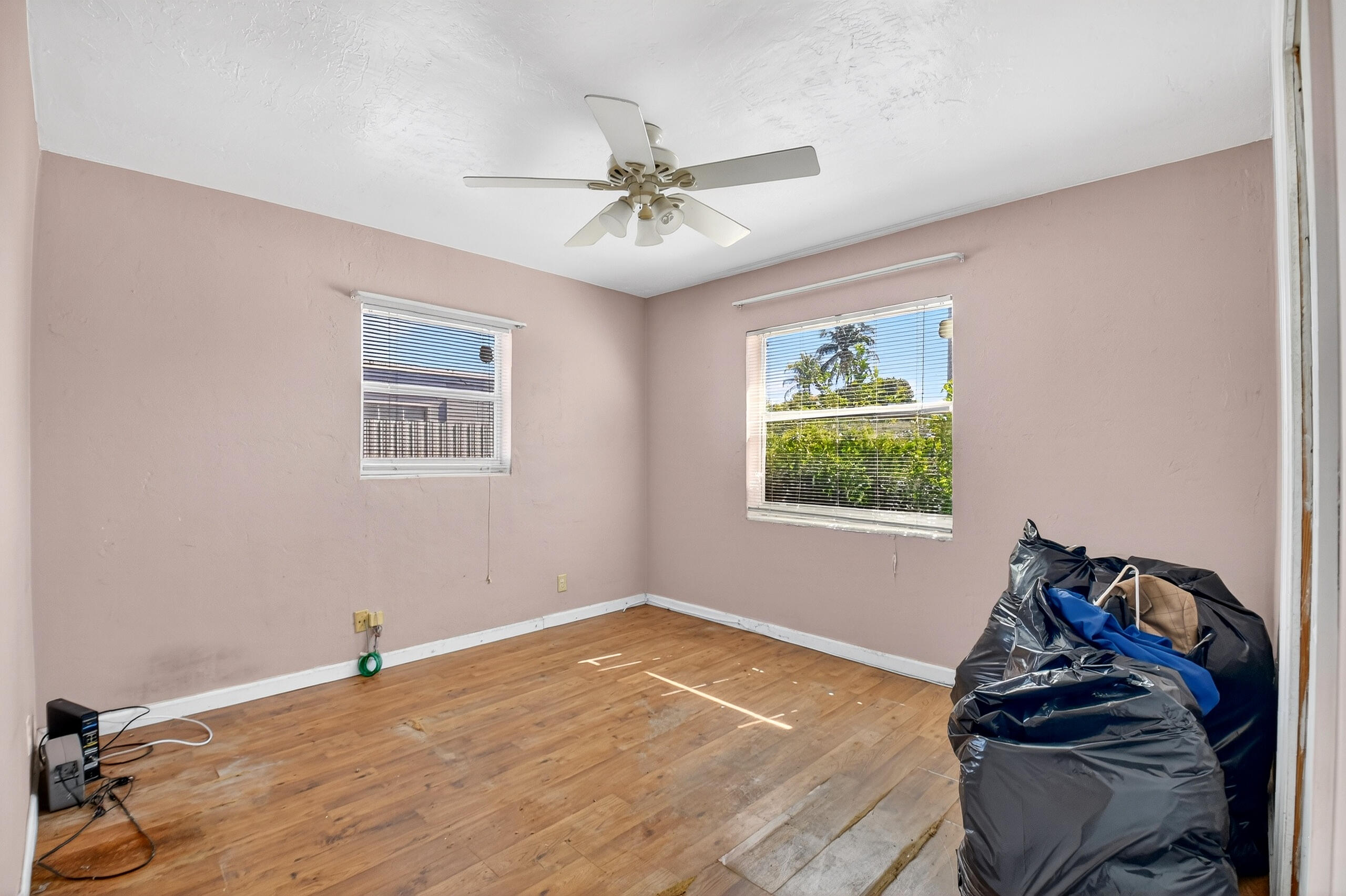 2013 Longwood Road West Palm Beach, FL 33409 - Photo 20 of 41 a bedroom with a bed and a window