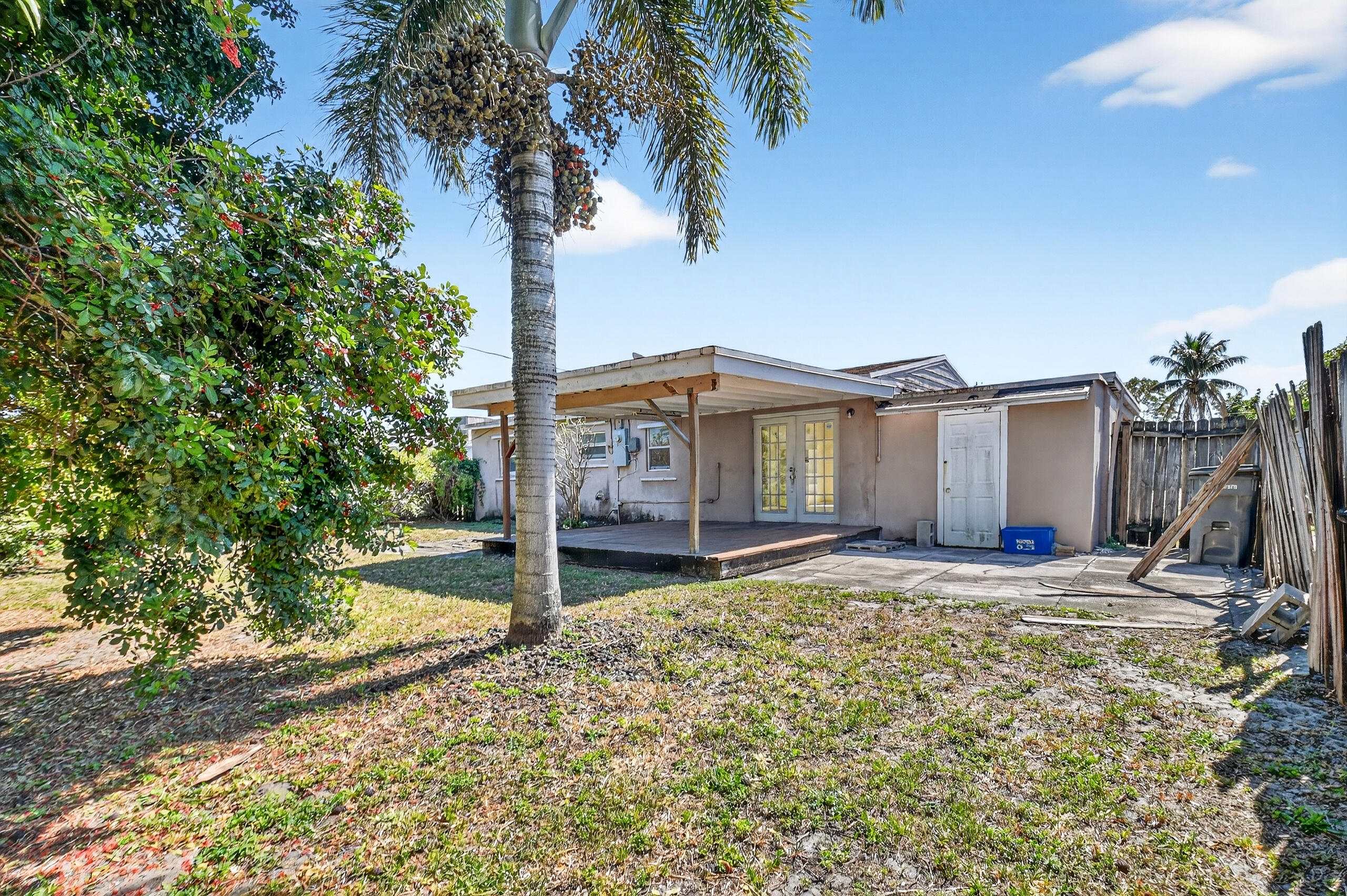 2013 Longwood Road West Palm Beach, FL 33409 - Photo 23 of 41 a view of a house with a yard and large tree