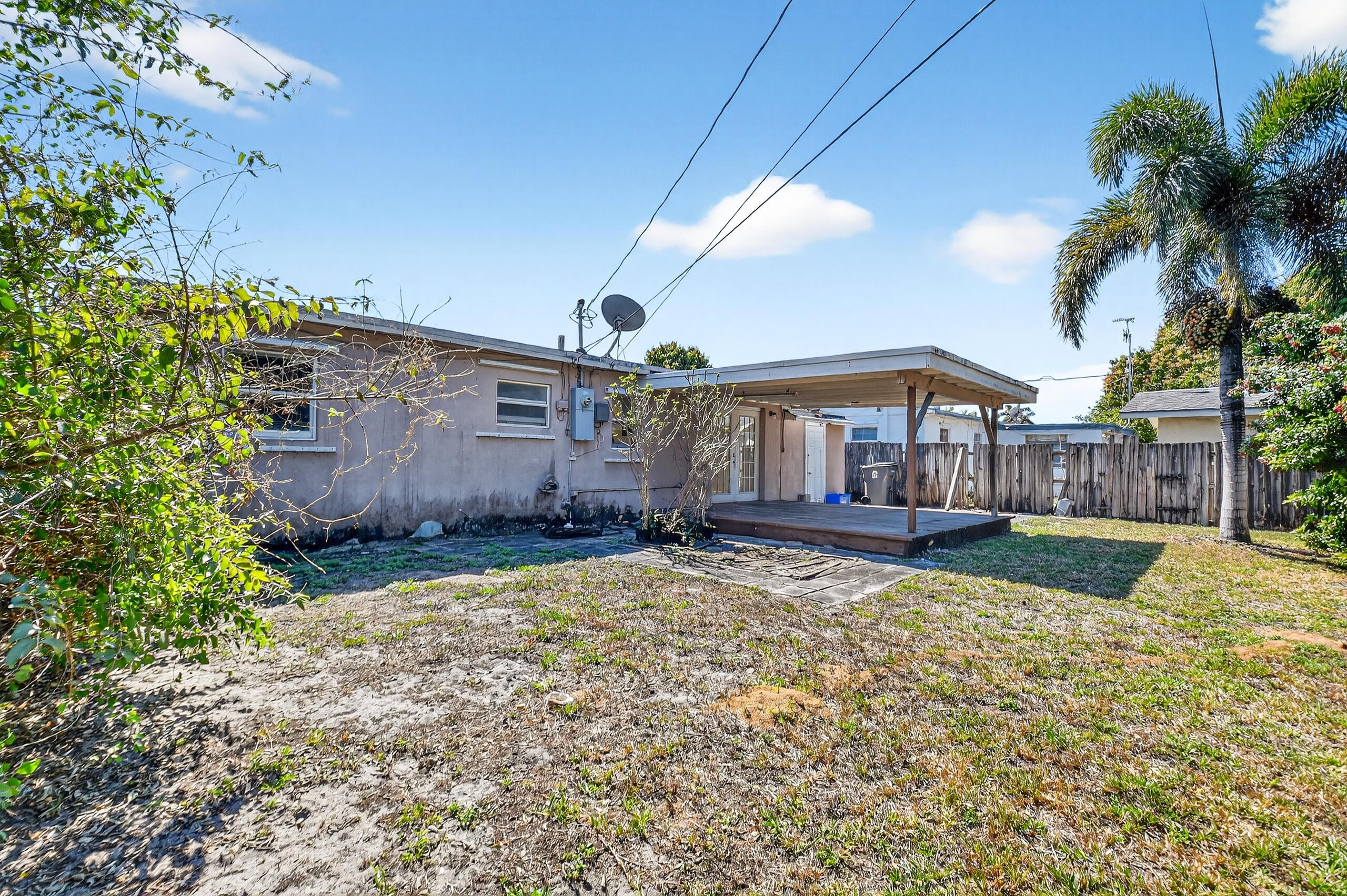 2013 Longwood Road West Palm Beach, FL 33409 - Photo 24 of 41 a view of a house with a yard