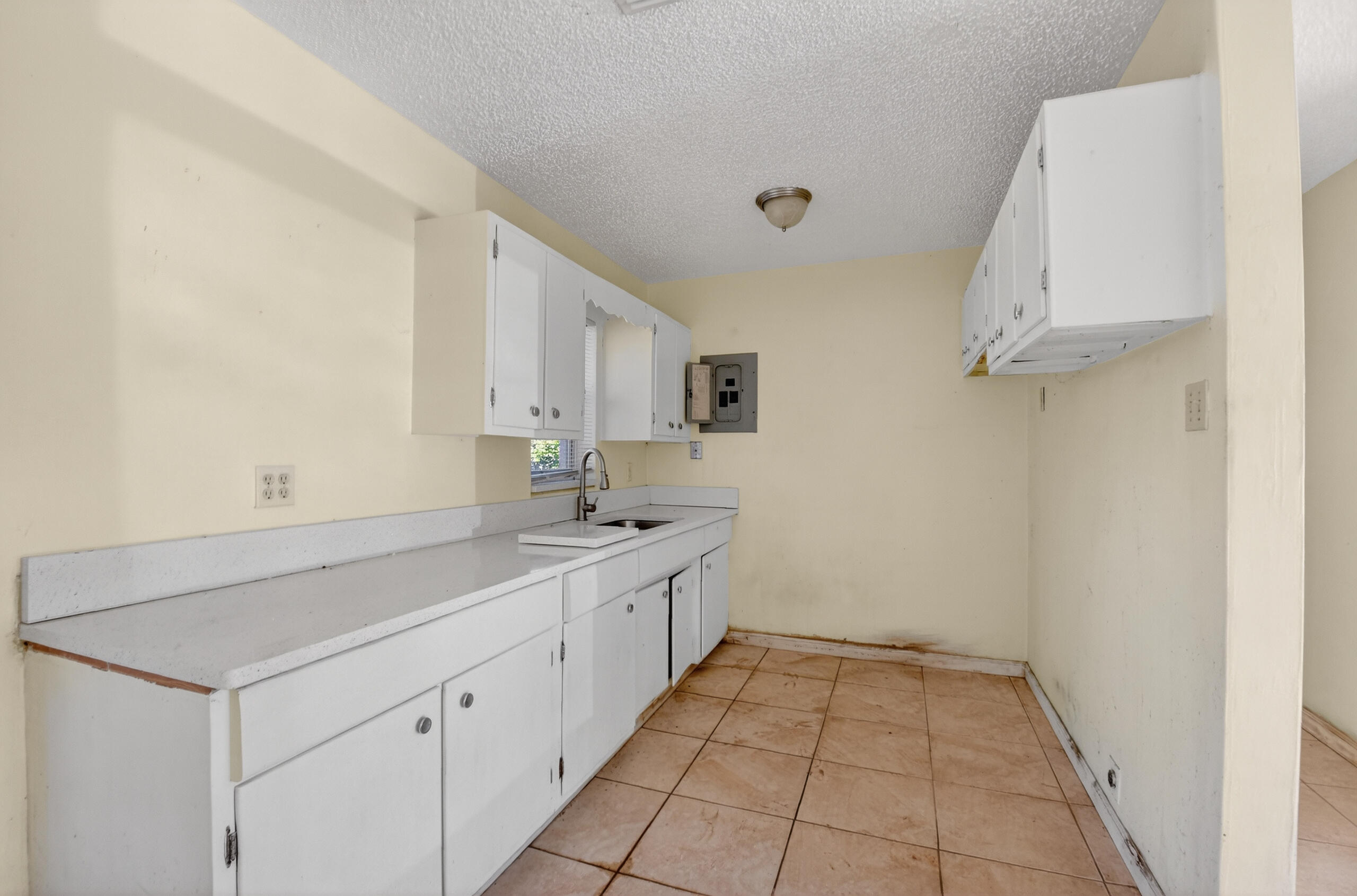 2013 Longwood Road West Palm Beach, FL 33409 - Photo 9 of 41 a room with a sink and cabinets