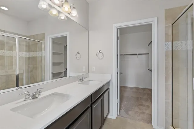 a bathroom with a double vanity sink mirror and double