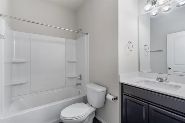 a bathroom with a sink a toilet and a bathtub