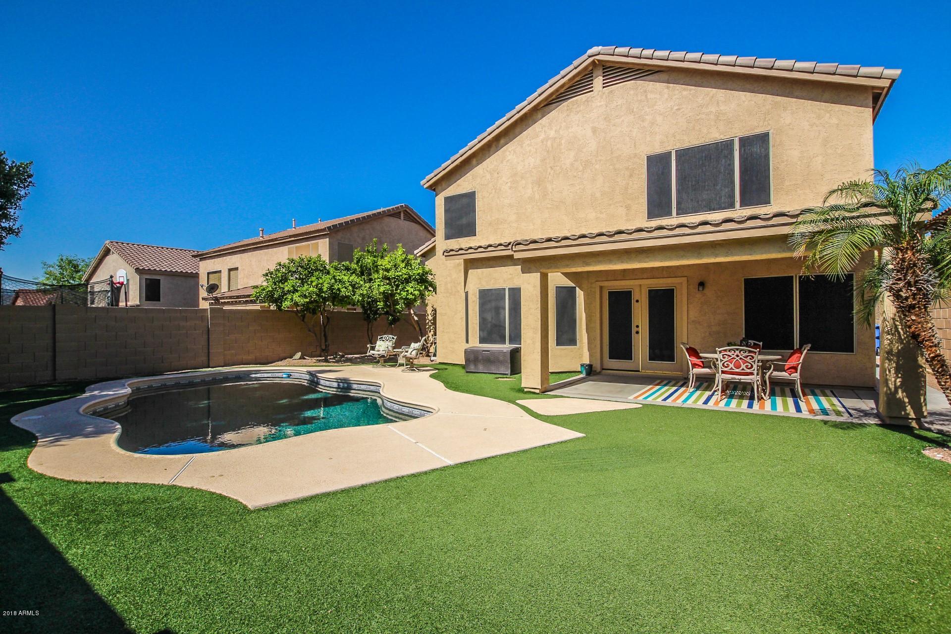 16033 South 18th Drive Phoenix, AZ 85045 - Photo 25 of 30 a view of a house with a yard and sitting area