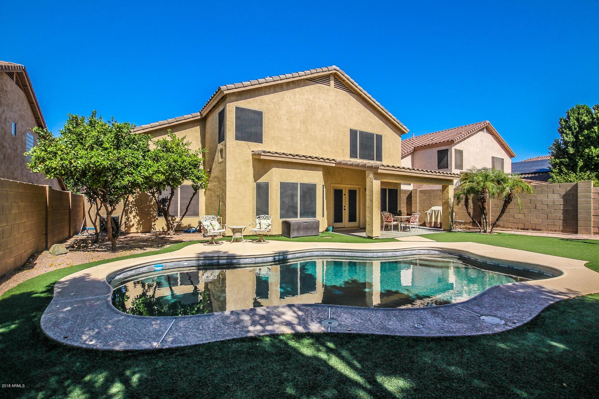 16033 South 18th Drive Phoenix, AZ 85045 - Photo 26 of 30 front view of a house with a swimming pool