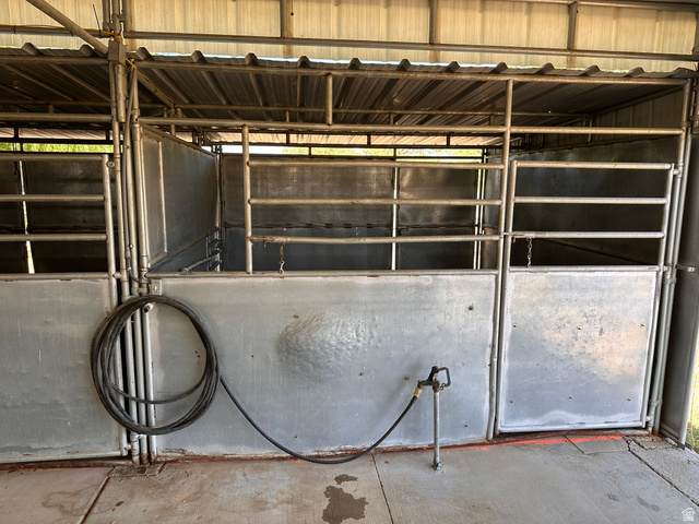 3732 Campbell Road Tooele, UT 84074 - Photo 54 of 69 Sheltered animal stalls featuring metal construction, a corrugated metal roof, and a built-in water spigot
