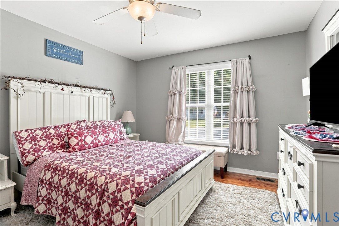 6401 Poplar Road Quinton, VA 23141 - Photo 15 of 46 Light gray walls and wood-finish flooring provide
