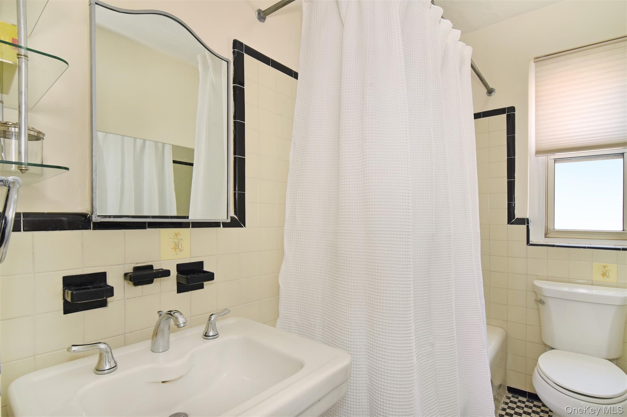 250 Bronxville Road, Unit 5A Bronxville, NY 10708 - Photo 11 of 20 a bathroom with a sink and a mirror