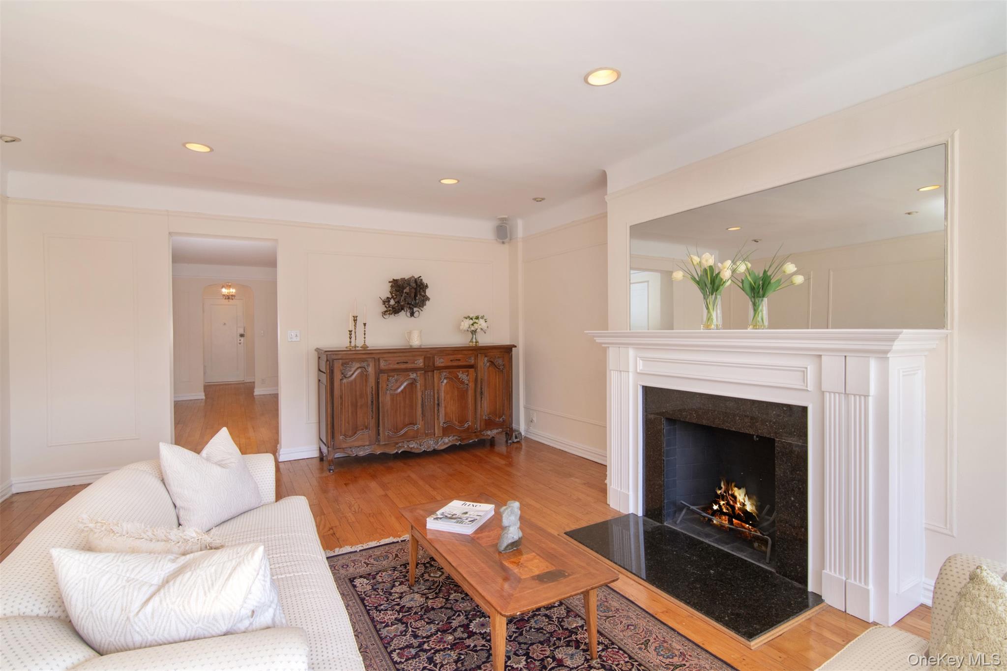 250 Bronxville Road, Unit 5A Bronxville, NY 10708 - Photo 4 of 20 a living room with furniture and a fireplace