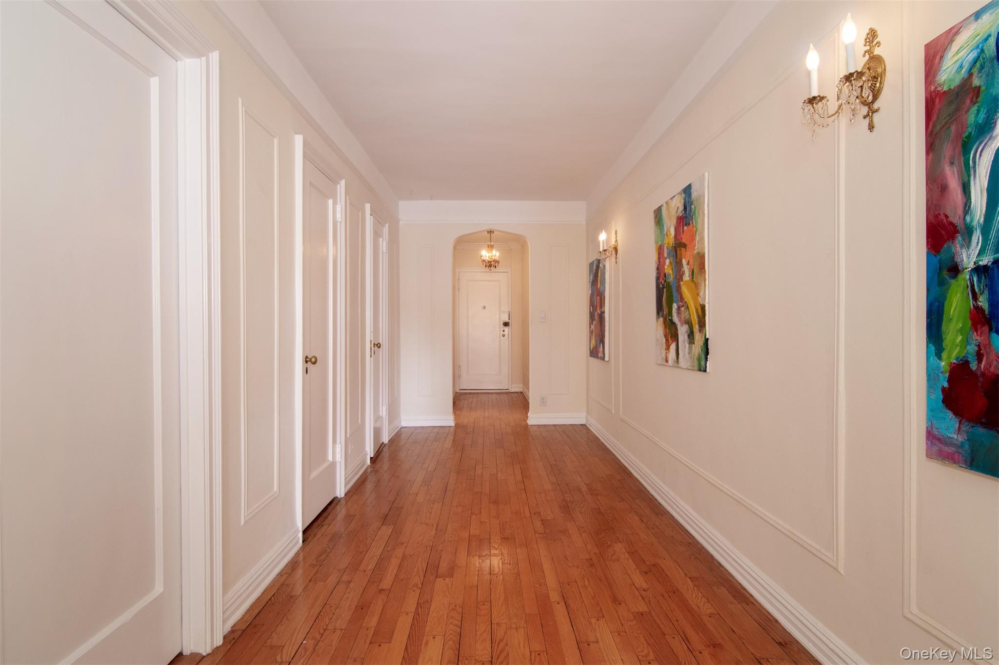 250 Bronxville Road, Unit 5A Bronxville, NY 10708 - Photo 5 of 20 a view of a hallway with wooden floor and a bathroom