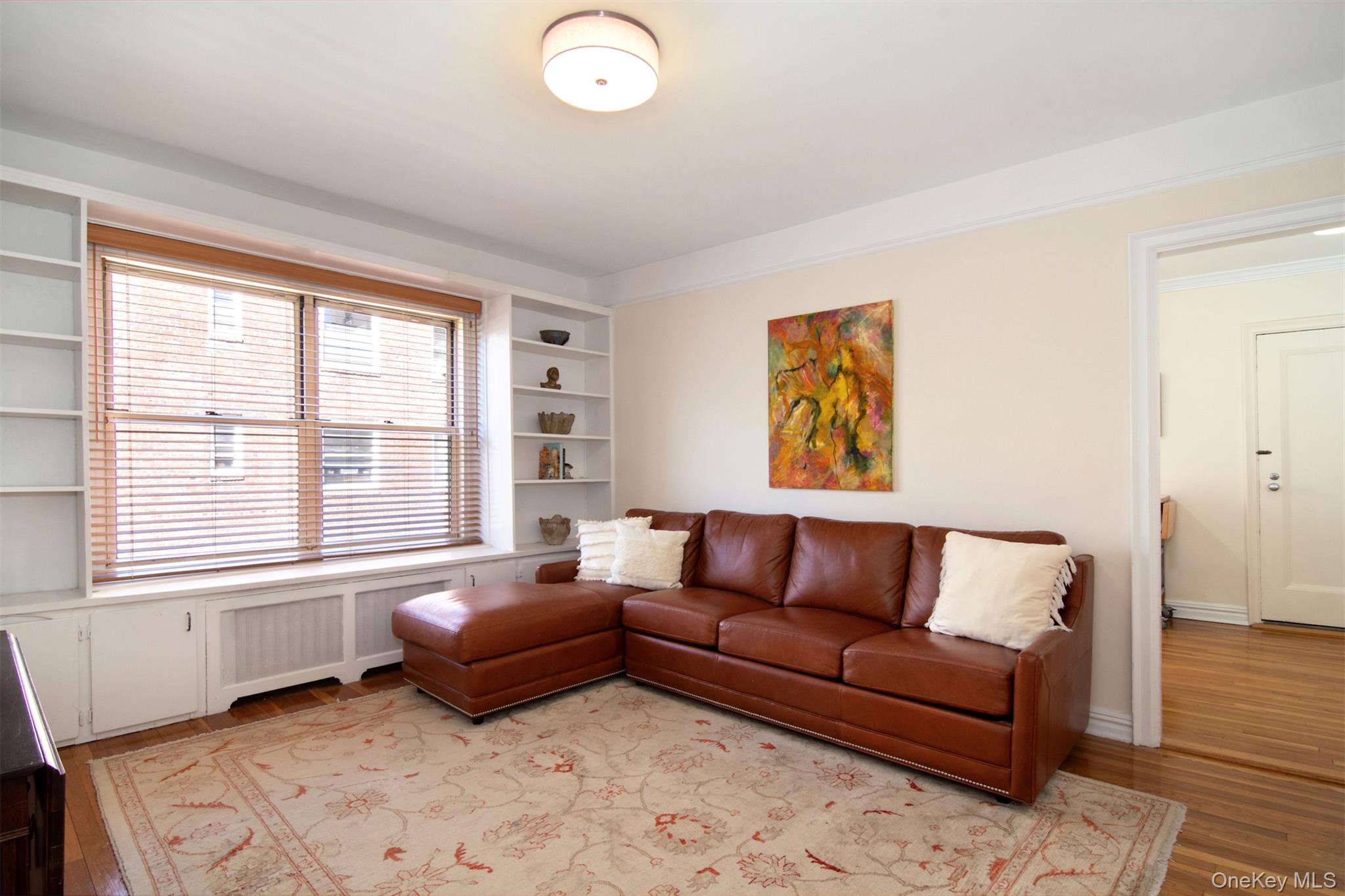250 Bronxville Road, Unit 5A Bronxville, NY 10708 - Photo 9 of 20 a bedroom with furniture and a large window