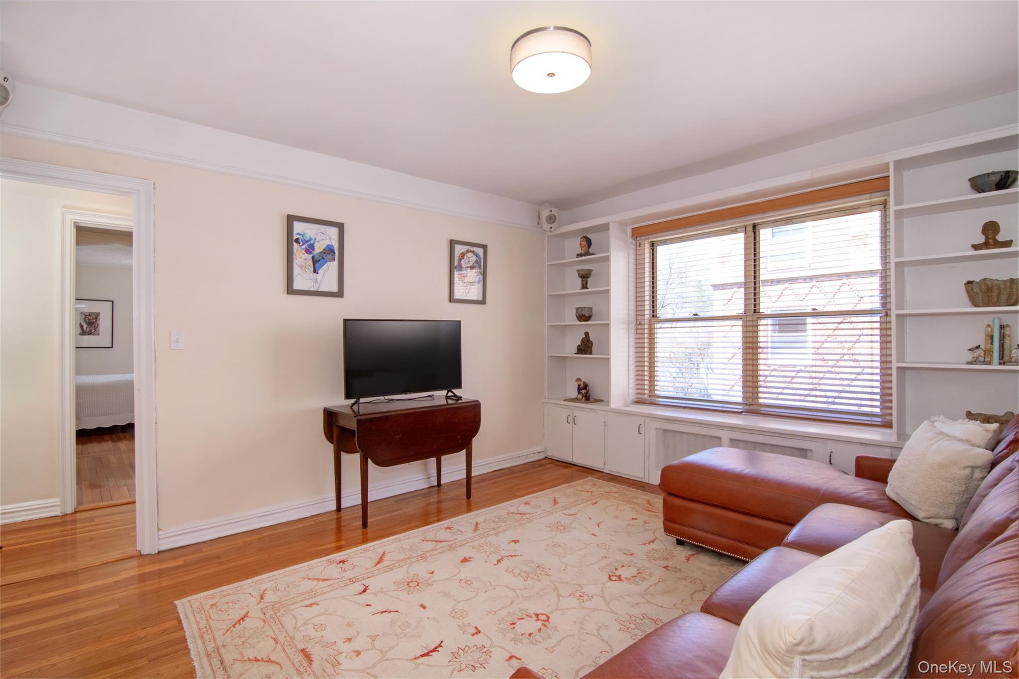 250 Bronxville Road, Unit 5A Bronxville, NY 10708 - Photo 10 of 20 a living room with furniture and a window