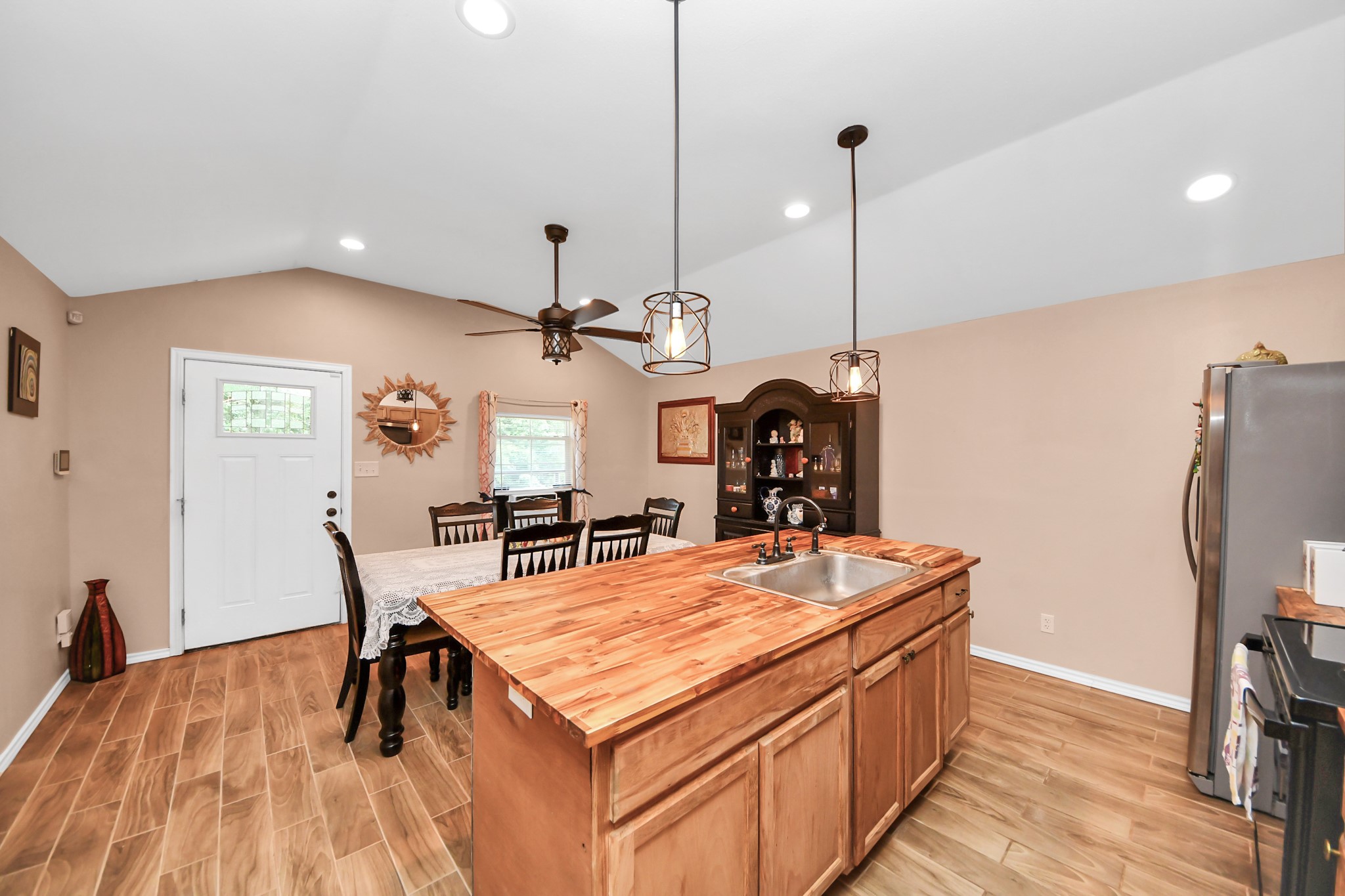 14961 Lamar Road Willis, TX 77378 - Photo 13 of 31 Dining or living combinations with a large island for additional seating.