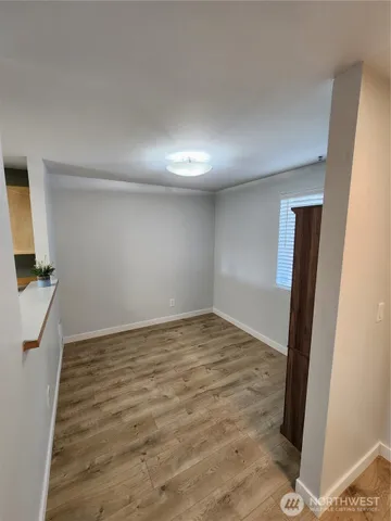 a view of a livingroom with a refrigerator