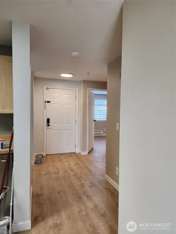 a view of a wooden house with a small yard