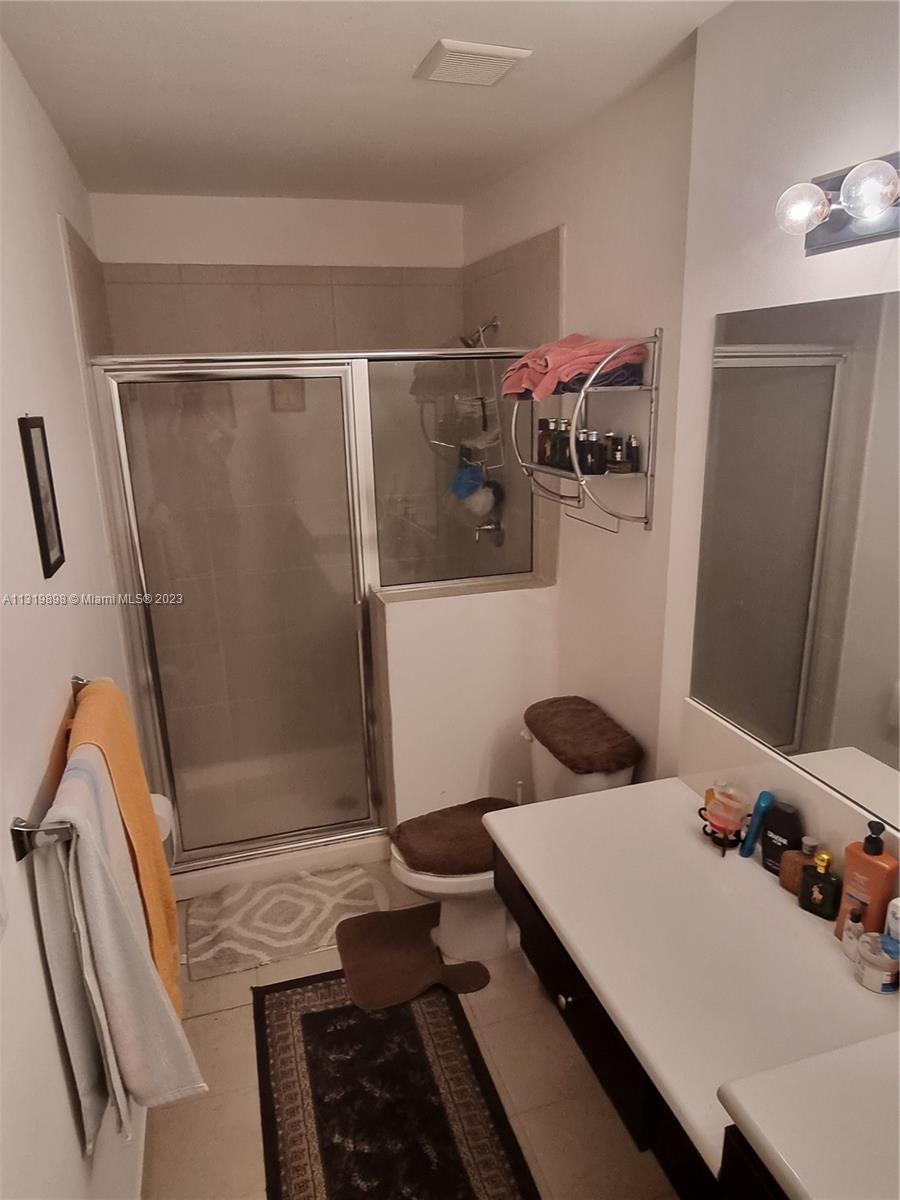 27534 Southwest 140th Avenue Homestead, FL 33032 - Photo 15 of 25 a bathroom with a sink and a shower