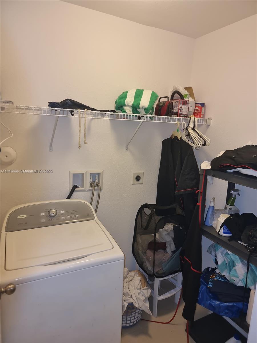 27534 Southwest 140th Avenue Homestead, FL 33032 - Photo 21 of 25 a utility room with dryer and washer