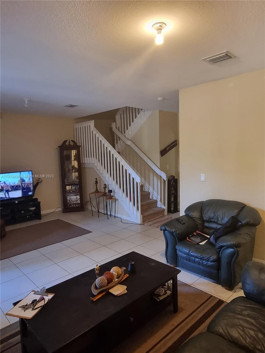 27534 Southwest 140th Avenue Homestead, FL 33032 - Photo 8 of 25 a living room with furniture and a window