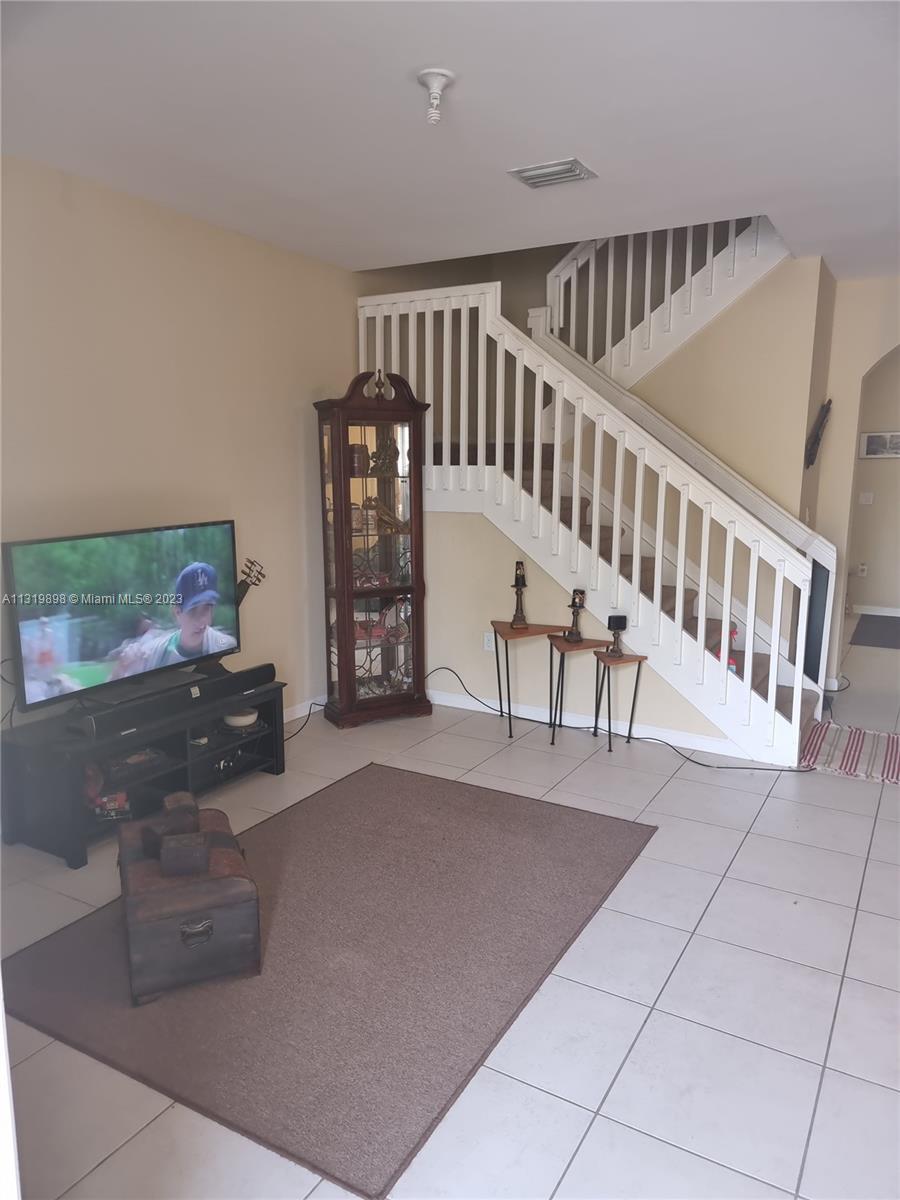 27534 Southwest 140th Avenue Homestead, FL 33032 - Photo 10 of 25 a view of livingroom with furniture and staircase