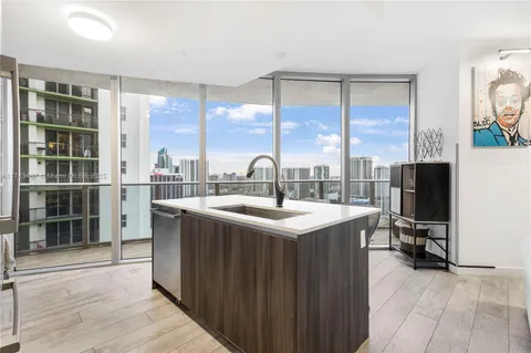 a kitchen with a sink and a stove