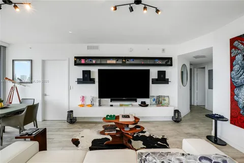 a room with furniture and a flat screen tv