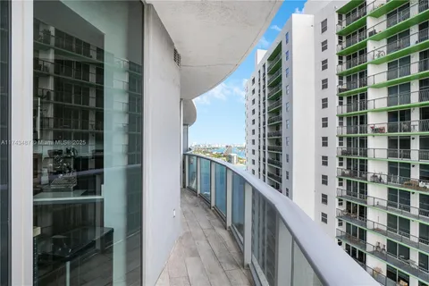 a view of balcony with wooden floor