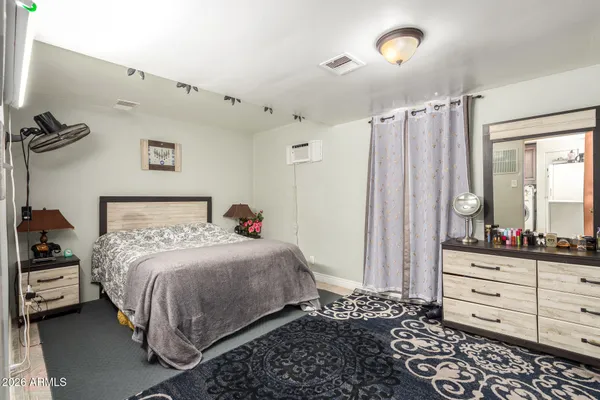 a bedroom with a bed and a closet