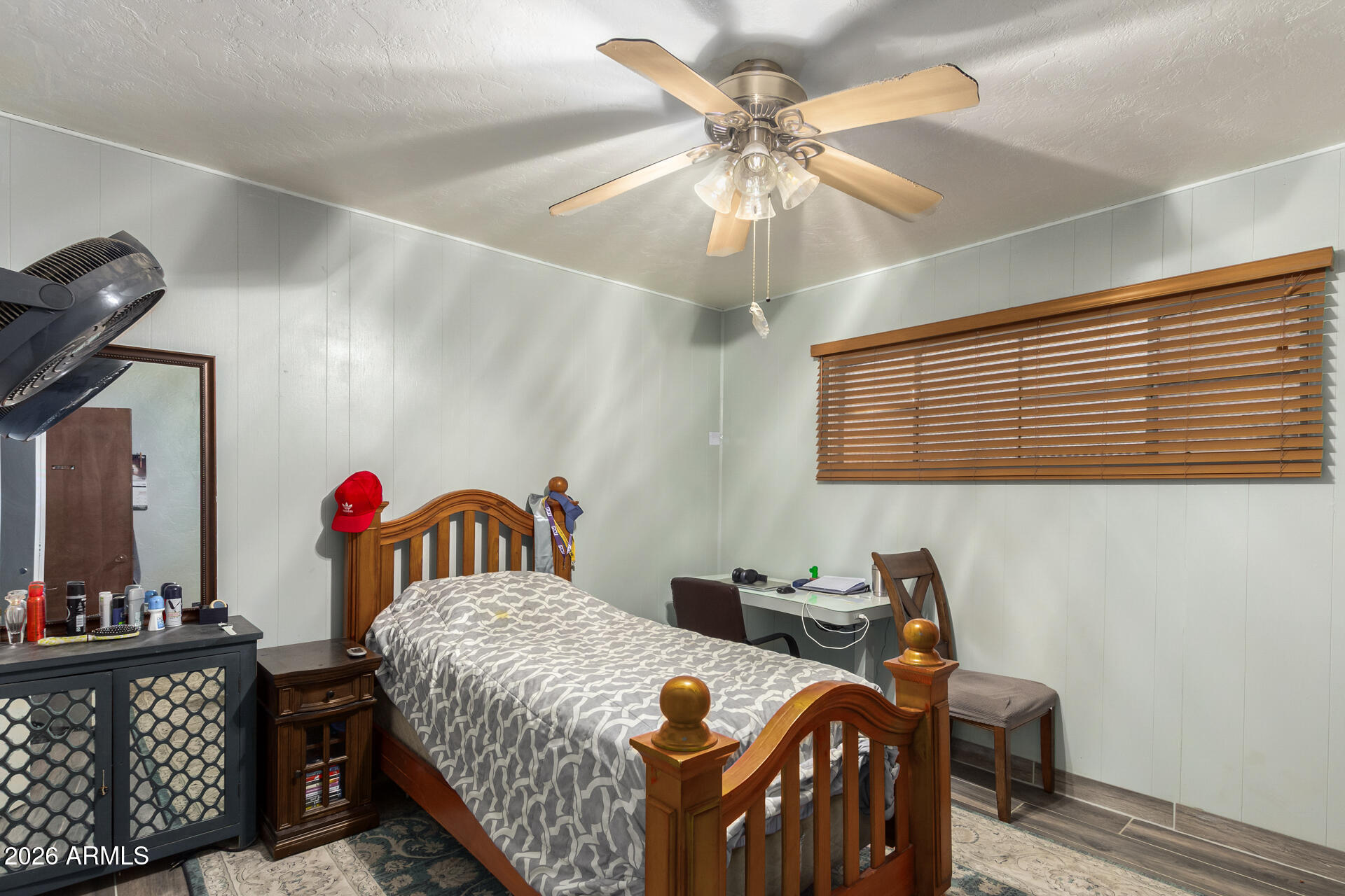 2825 North 33rd Place Phoenix, AZ 85008 - Photo 19 of 27 a bedroom with a bed and a chandelier