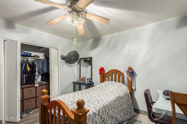 a bedroom with furniture and a chandelier