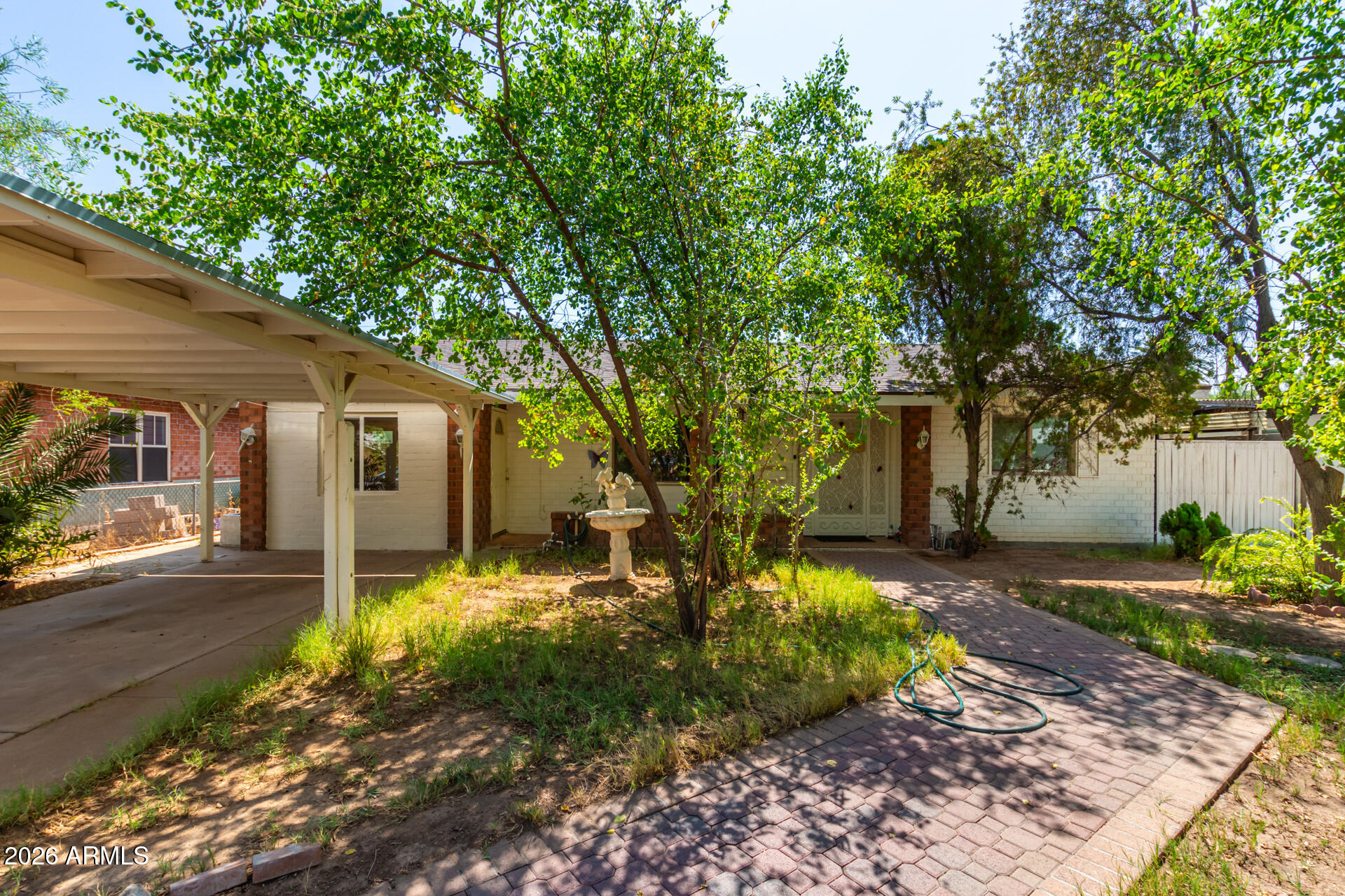 2825 North 33rd Place Phoenix, AZ 85008 - Photo 2 of 27 a backyard of a house with yard and outdoor seating