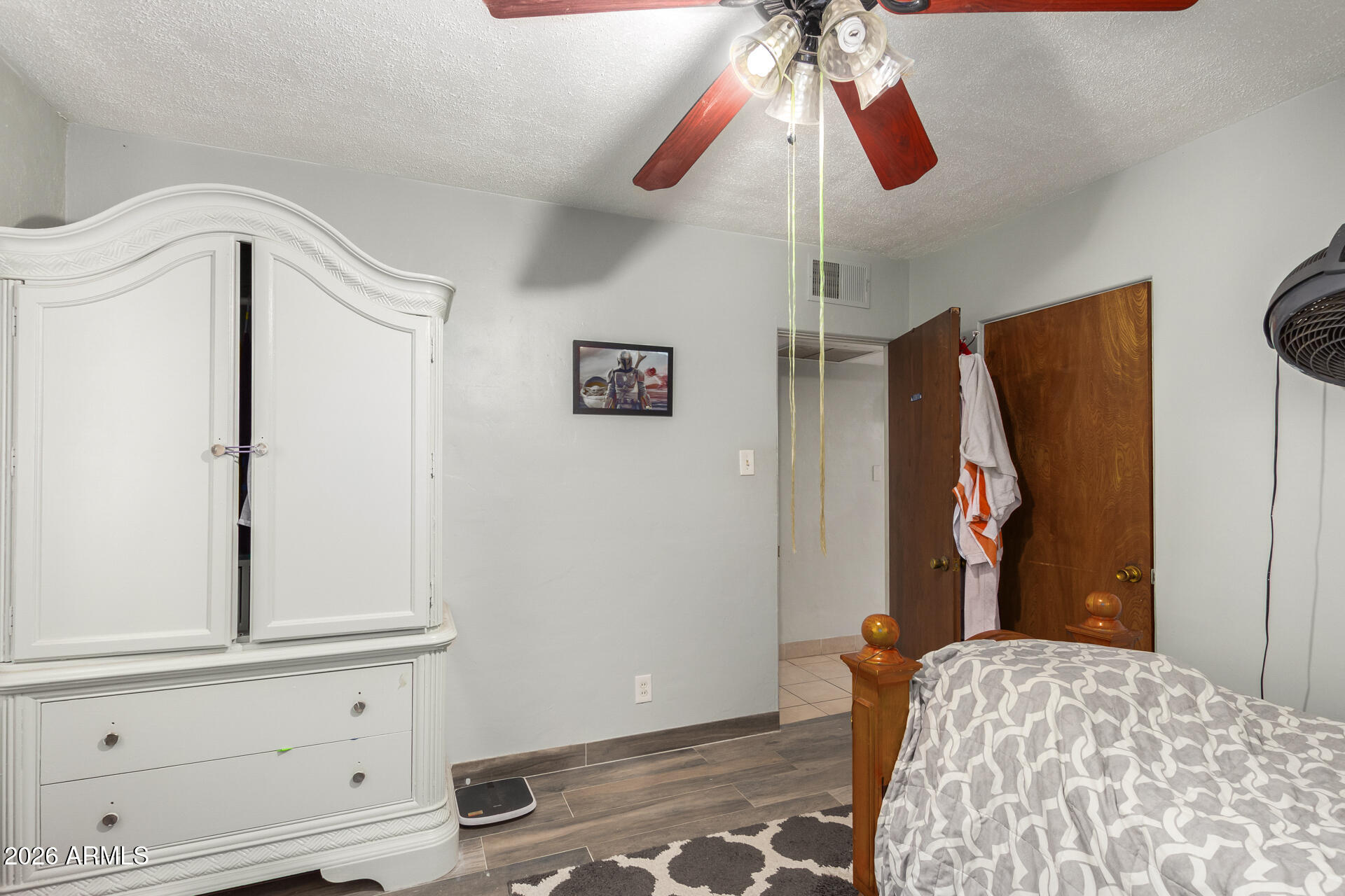 2825 North 33rd Place Phoenix, AZ 85008 - Photo 21 of 27 a bedroom with a bed and a window