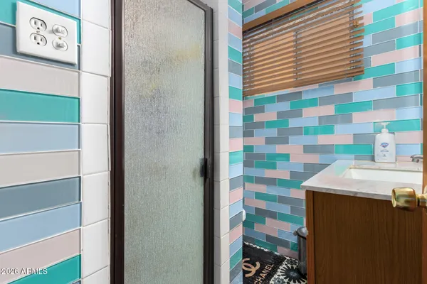 a bathroom with a sink and a shower