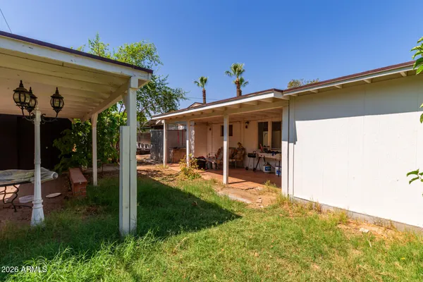 a view of a house with porch and furniture