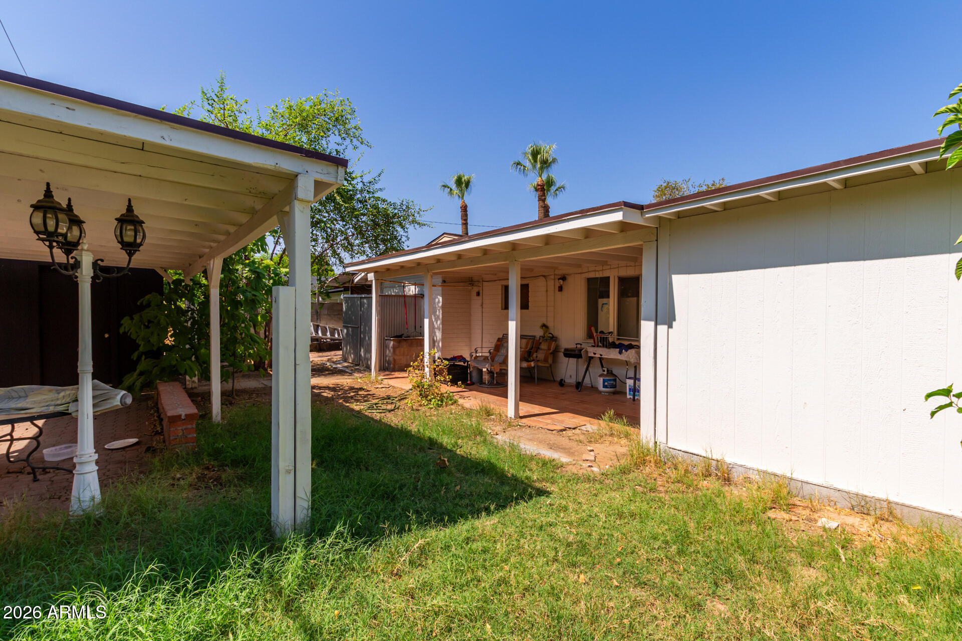 2825 North 33rd Place Phoenix, AZ 85008 - Photo 25 of 27 a view of a house with porch and furniture