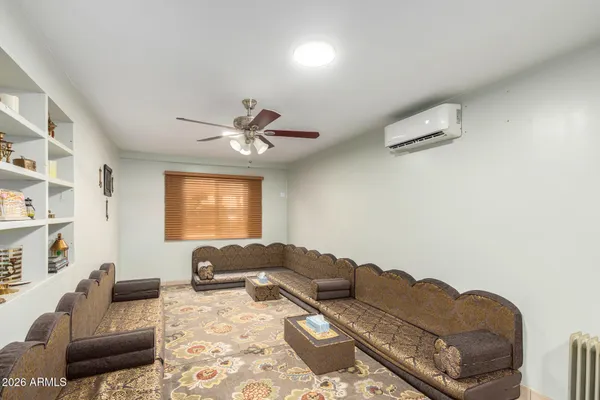 a living room with furniture and a window