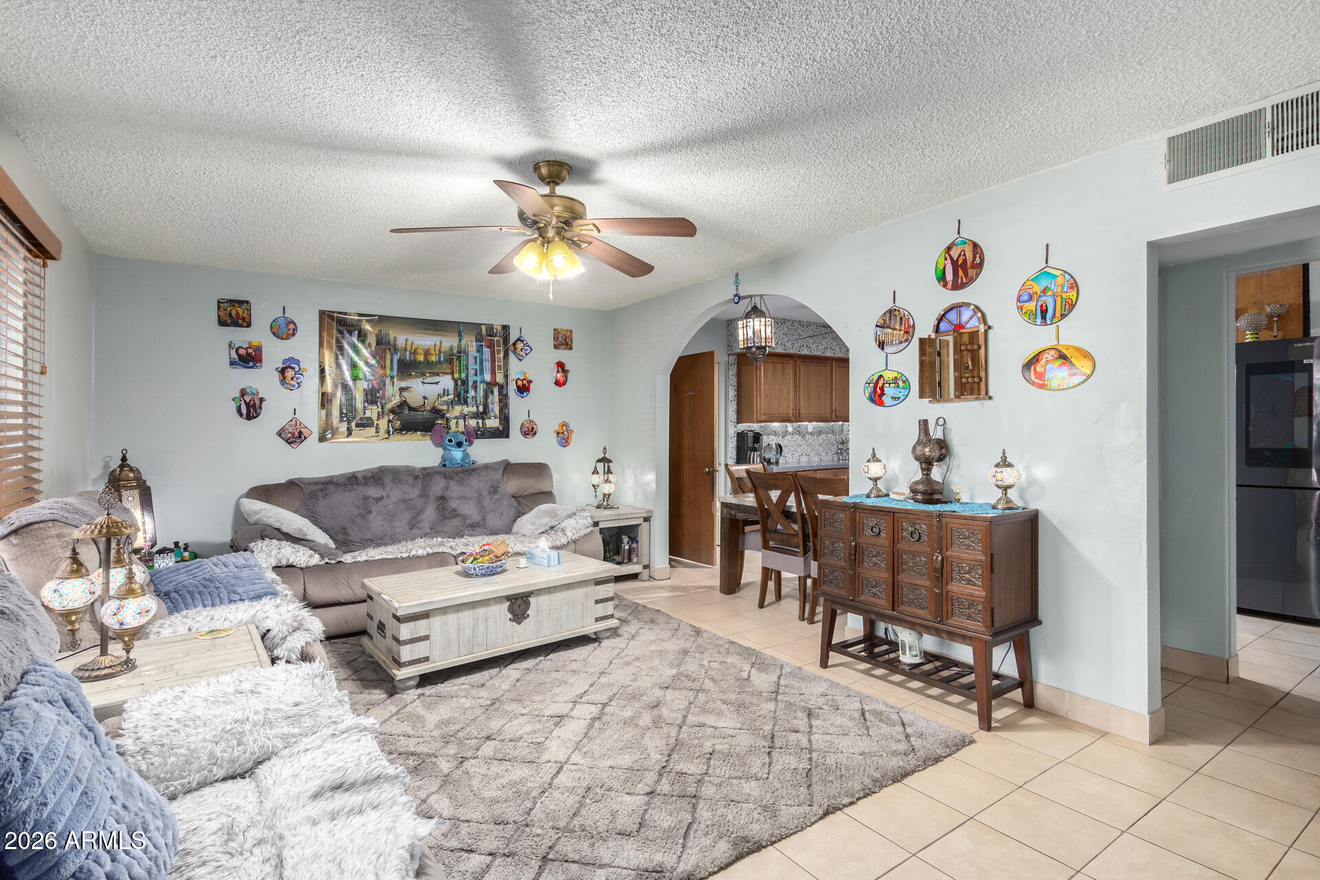2825 North 33rd Place Phoenix, AZ 85008 - Photo 9 of 27 a living room with furniture and a flat screen tv