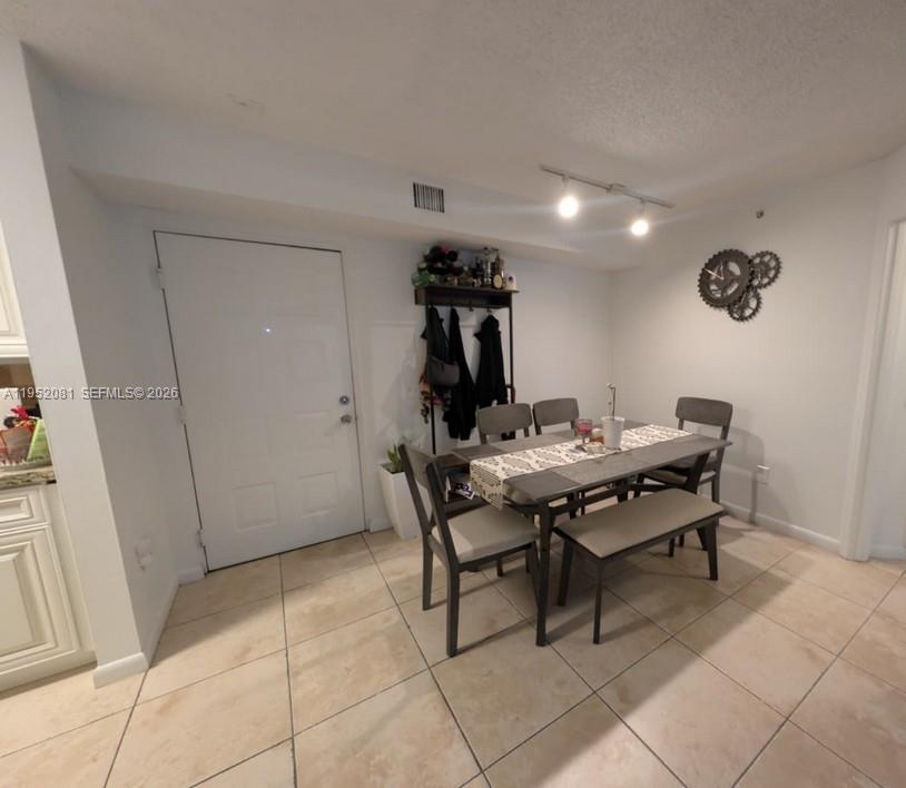 430 South Park Road, Unit 3108 Hollywood, FL 33021 - Photo 2 of 7 a view of a dining room with furniture and chandelier