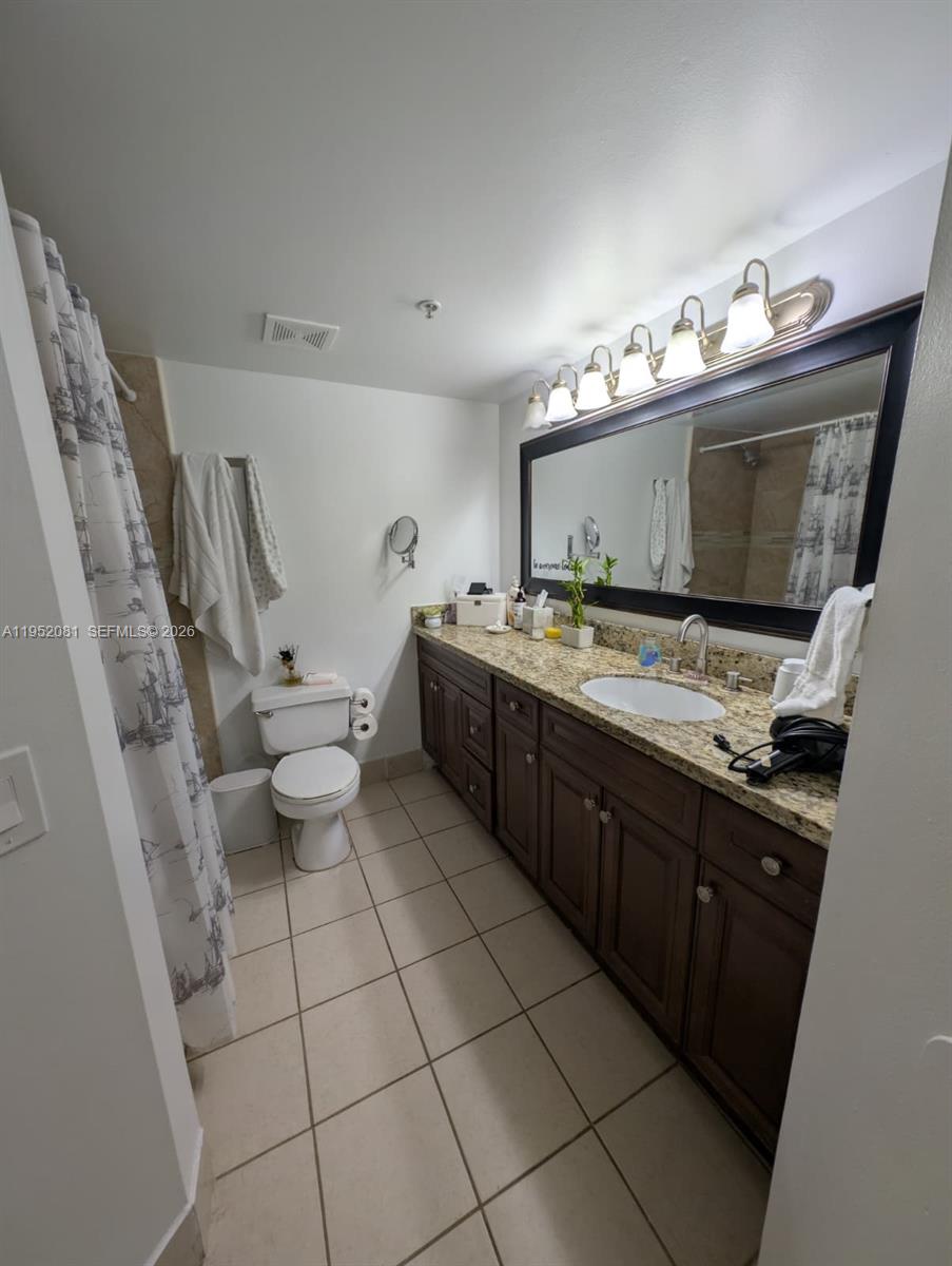 430 South Park Road, Unit 3108 Hollywood, FL 33021 - Photo 6 of 7 a kitchen with a sink a stove and cabinets