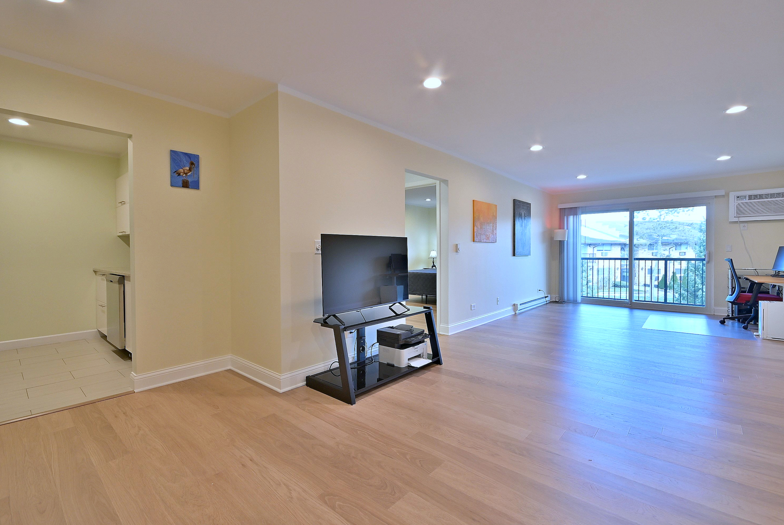 836 East Old Willow Road, Unit 211 Prospect Heights, IL 60070 - Photo 11 of 28 a view of a livingroom with furniture and a flat screen tv