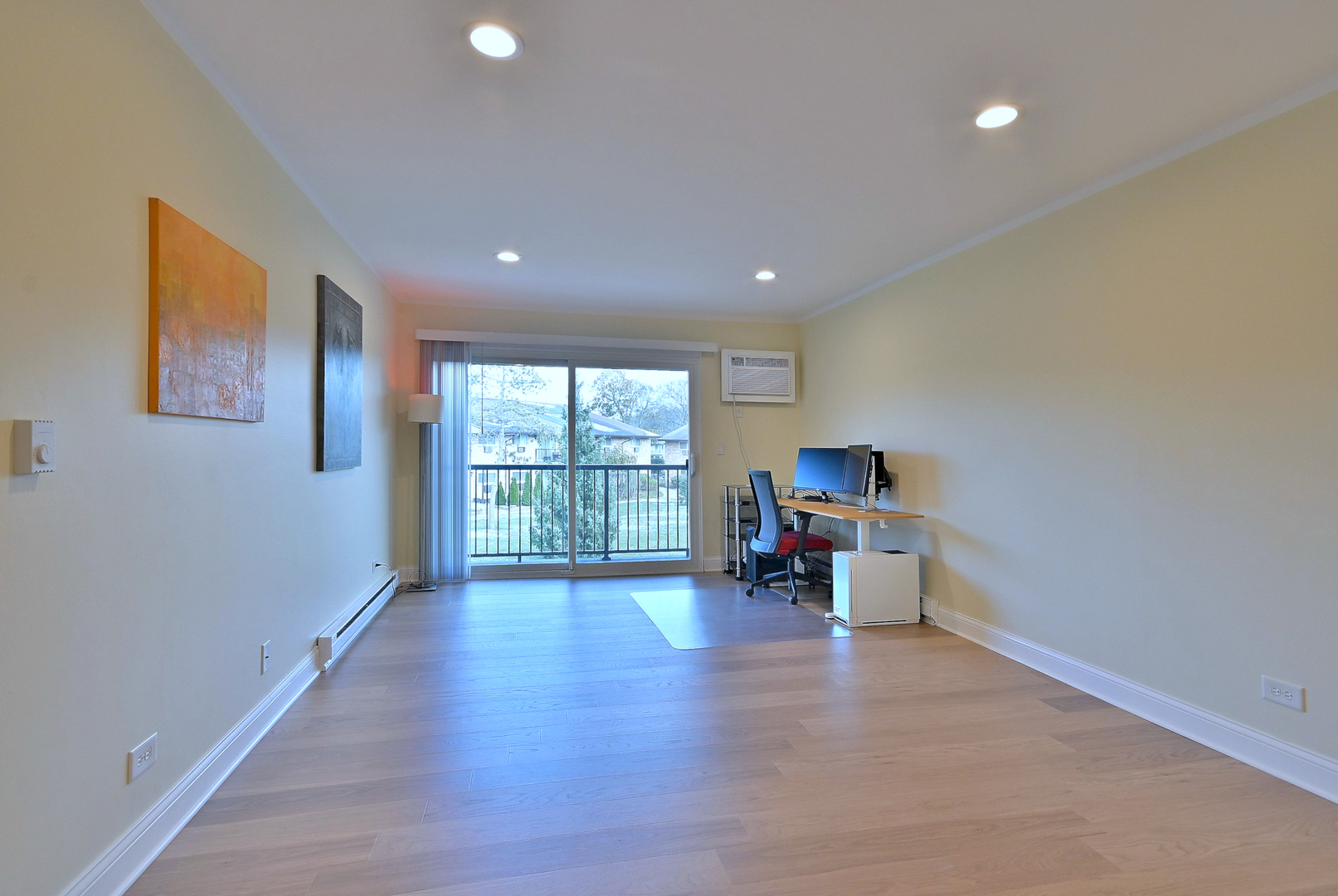836 East Old Willow Road, Unit 211 Prospect Heights, IL 60070 - Photo 13 of 28 a big room with wooden floor and a window