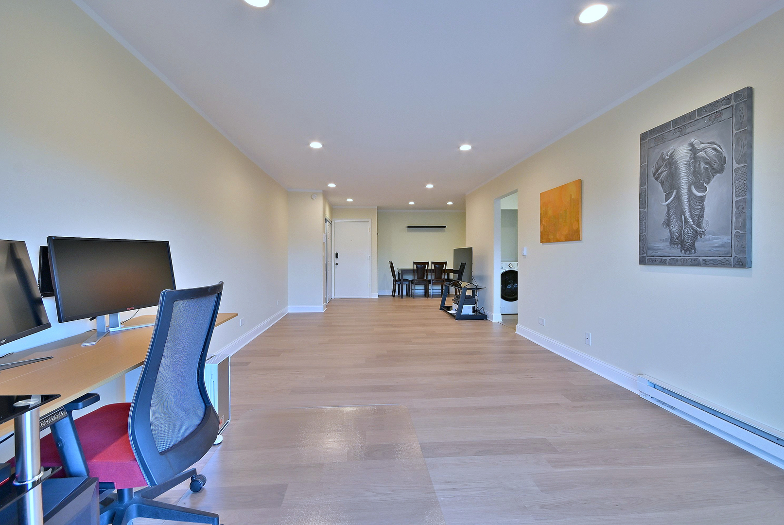 836 East Old Willow Road, Unit 211 Prospect Heights, IL 60070 - Photo 14 of 28 a room with furniture and a flat screen tv